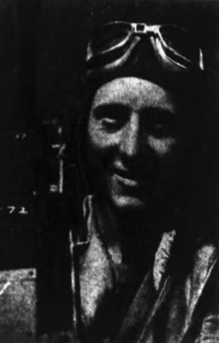 Willard James Hadjes in flying gear beside aircraft cockpit structure