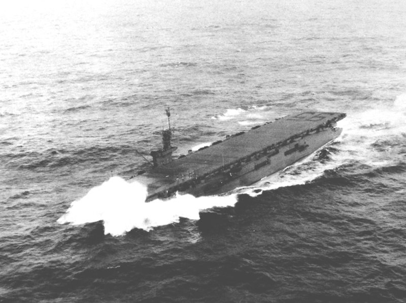 Escort carrier USS Bismarck Sea underway in a heavy sea