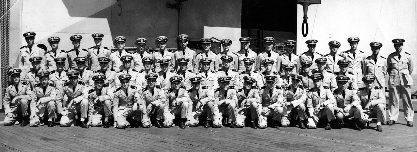 Group photograph of Composite Squadron 86 officers on the deck of USS Bismarck Sea