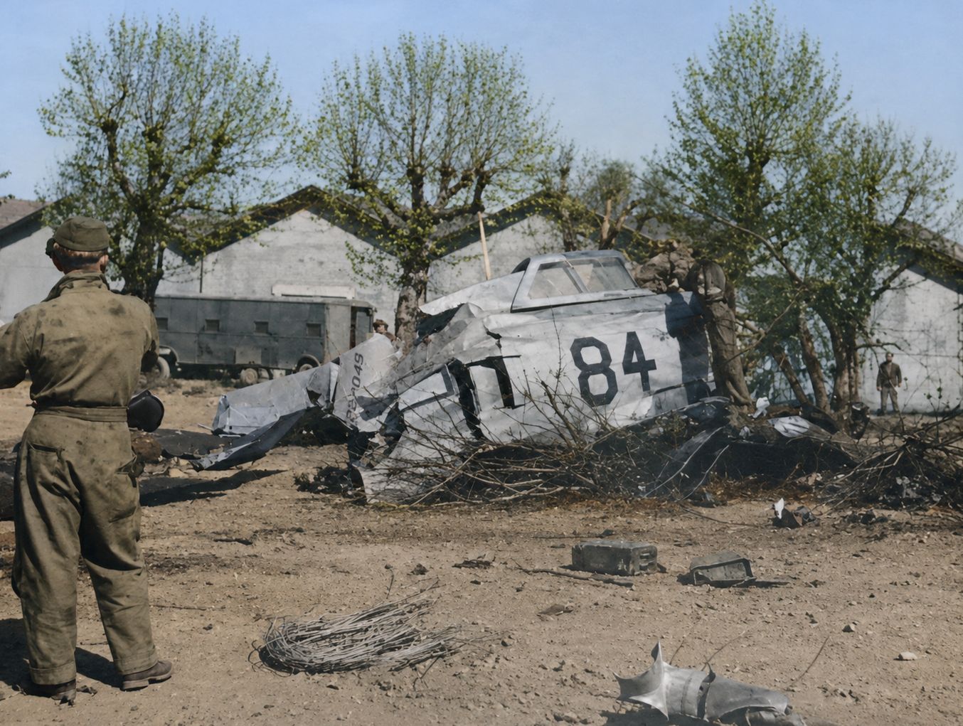 Wrecked aircraft numbered 84 on the ground
